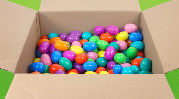 a cardboard box filled with colorful plastic Easter eggs in bulk